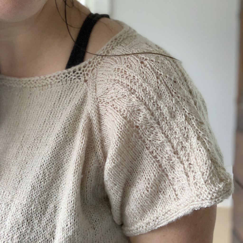 Close up detail of lace sleeve of the Minerva Tee